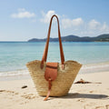 Straw basket bag with leather closure and long straps - handmade in Morocco